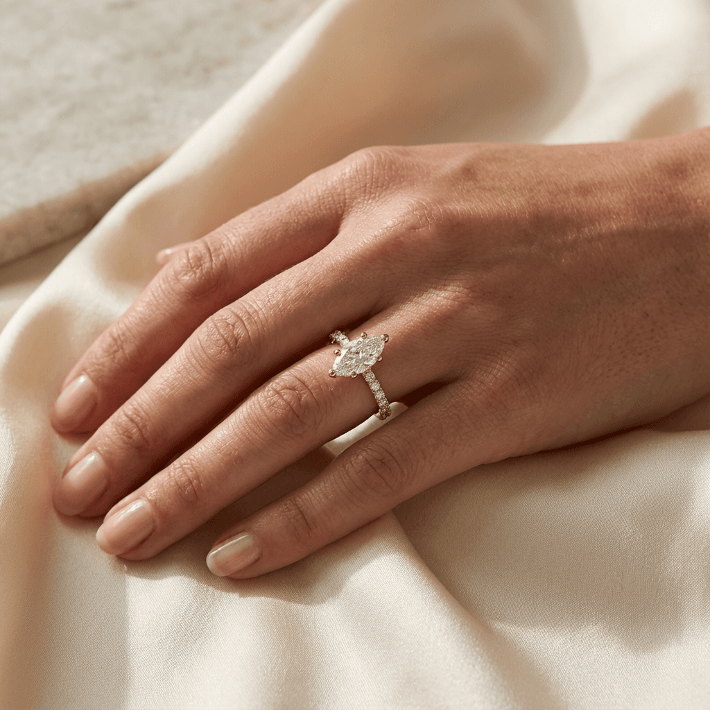 A diamond engagement ring in golden light