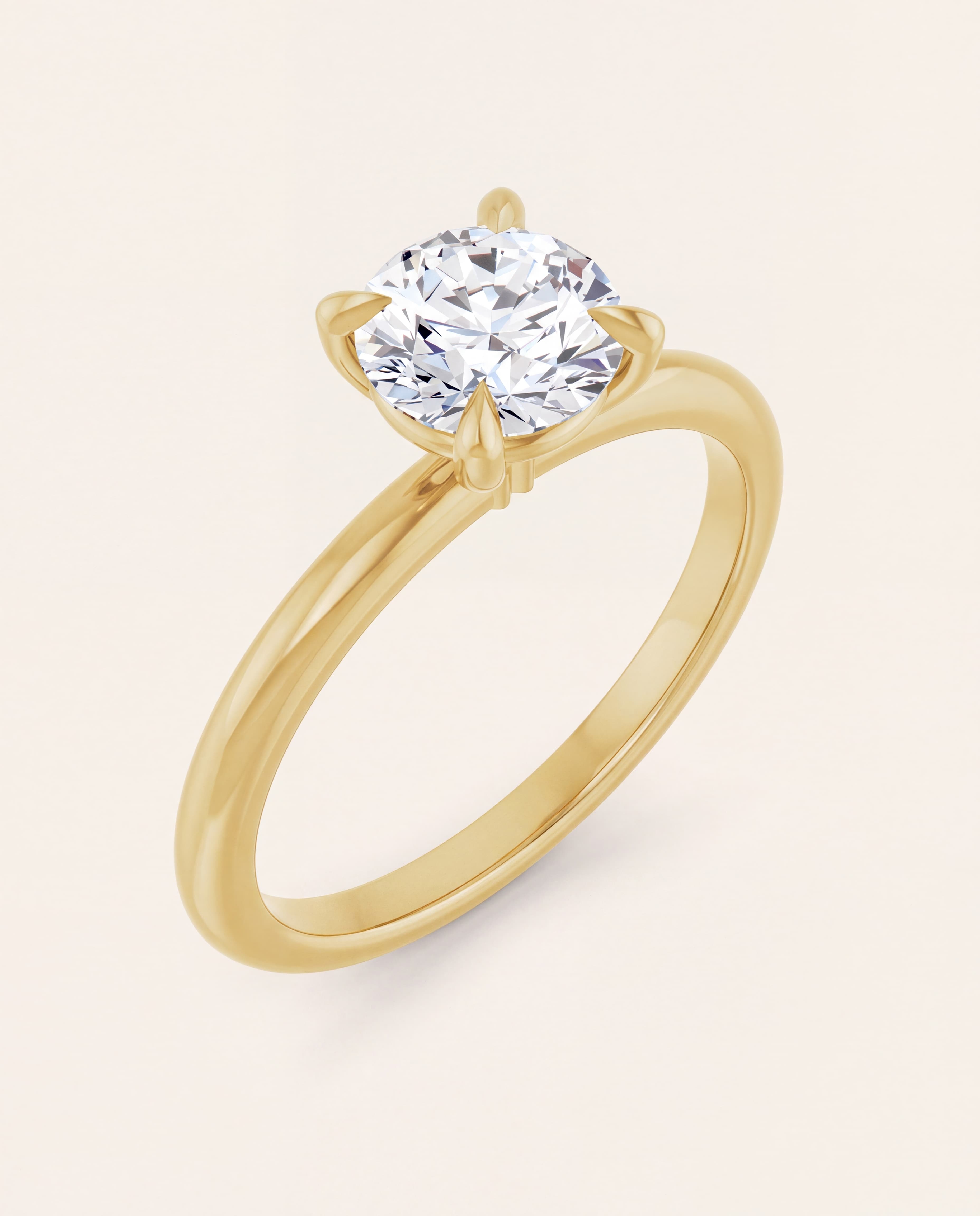 Claw Prong Round Solitaire Engagement Ring in yellow gold