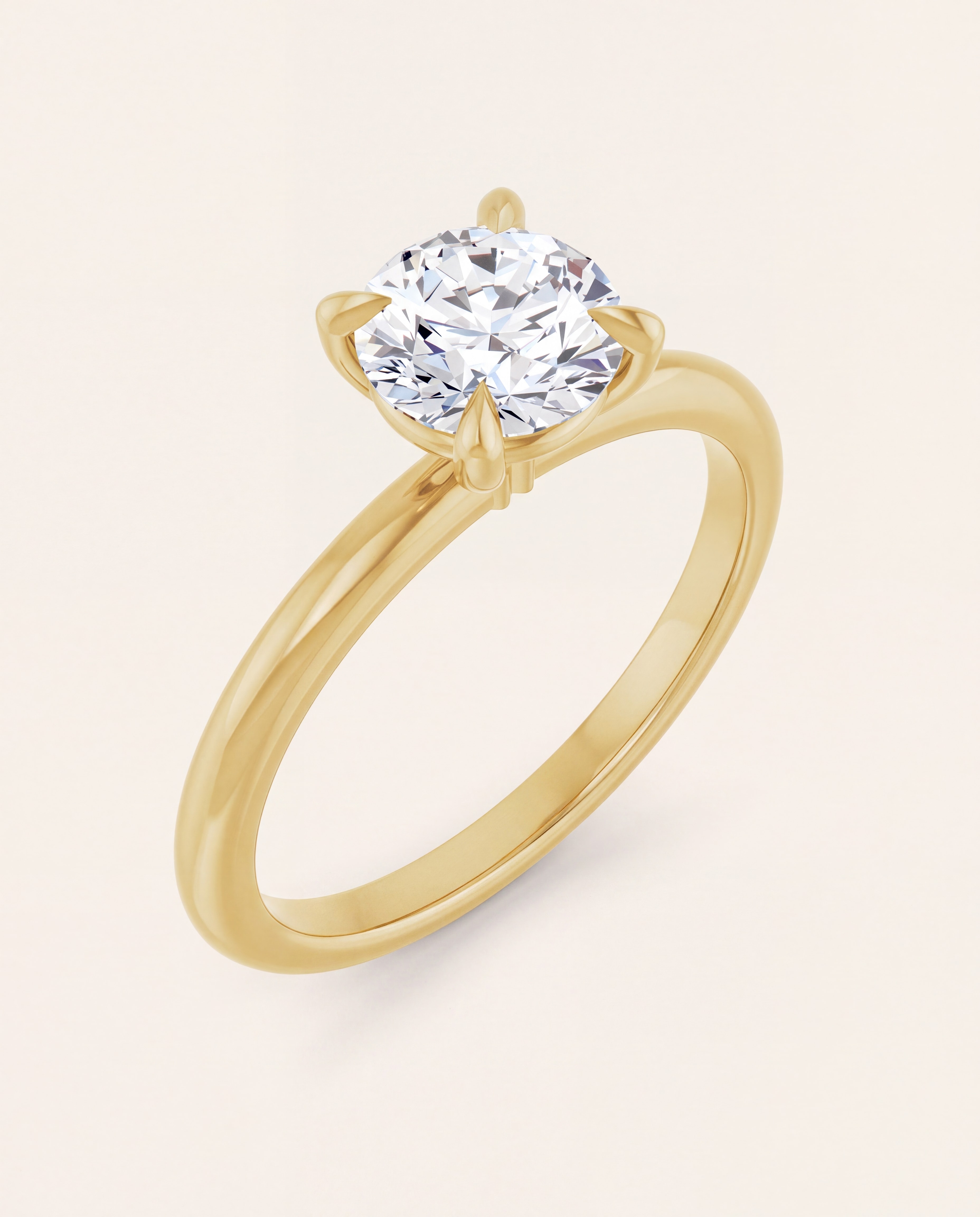 Claw Prong Round Solitaire Engagement Ring in yellow gold