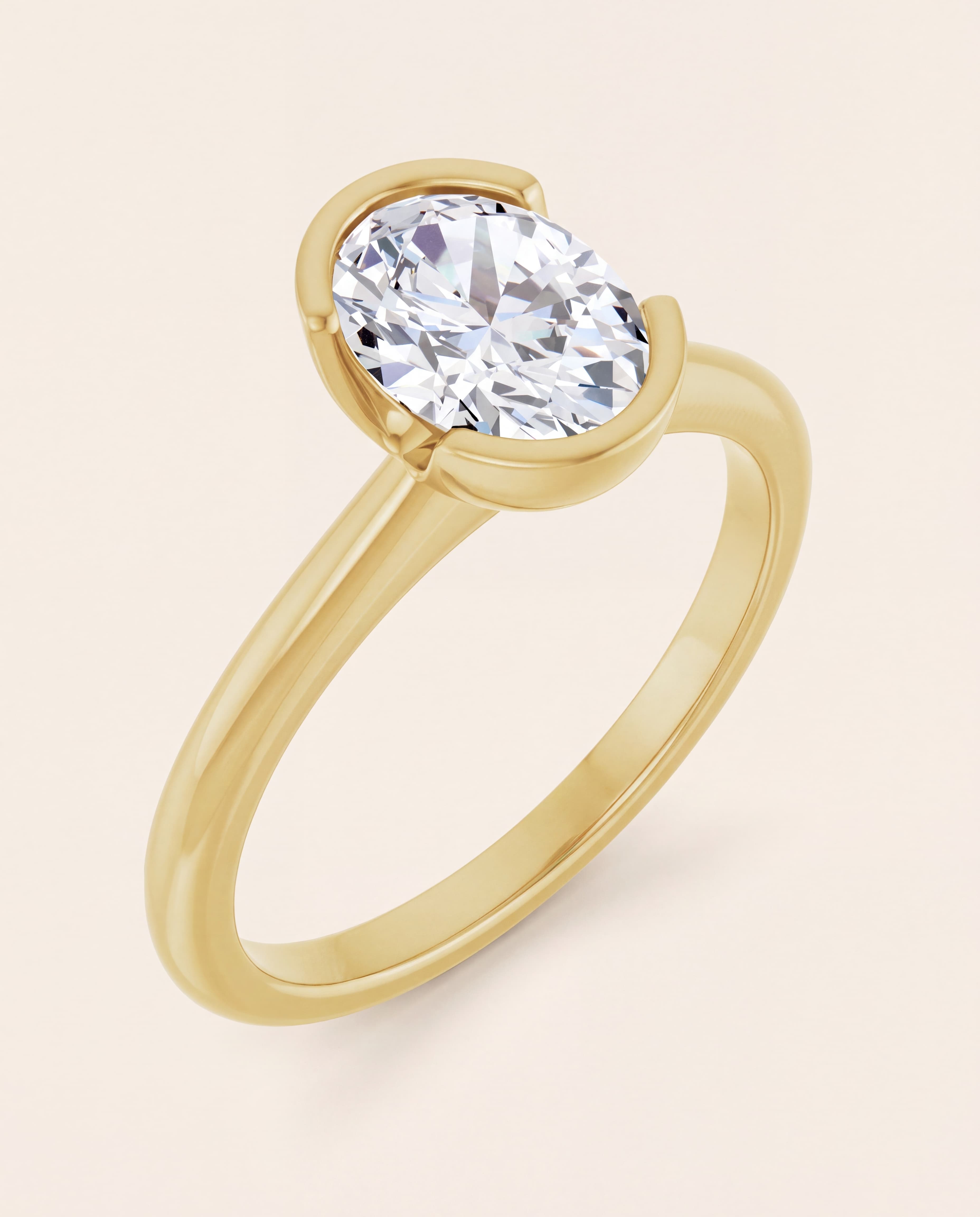 Half Bezel Oval Engagement Ring in yellow gold