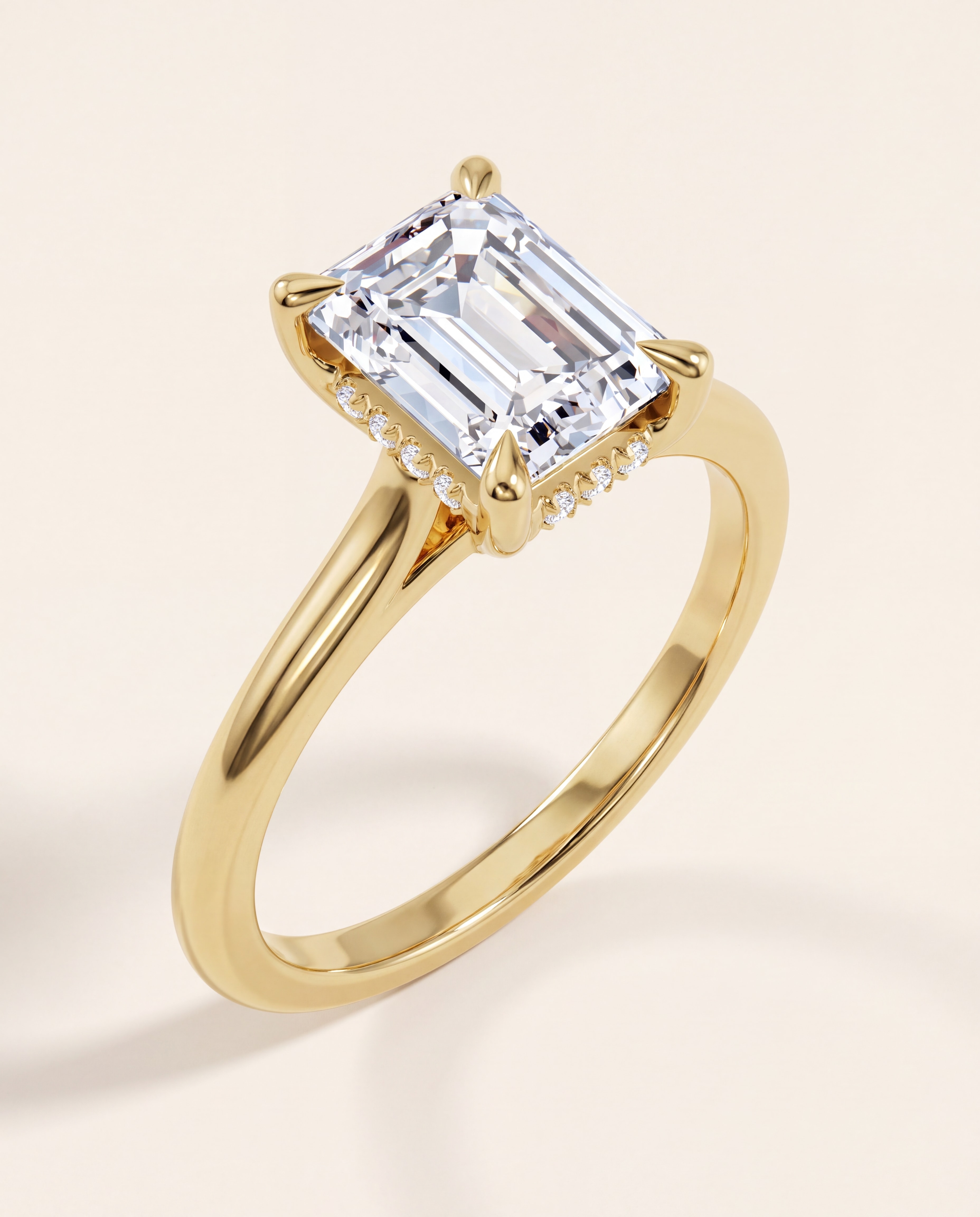 Hidden Halo Emerald Cut Engagement Ring in yellow gold