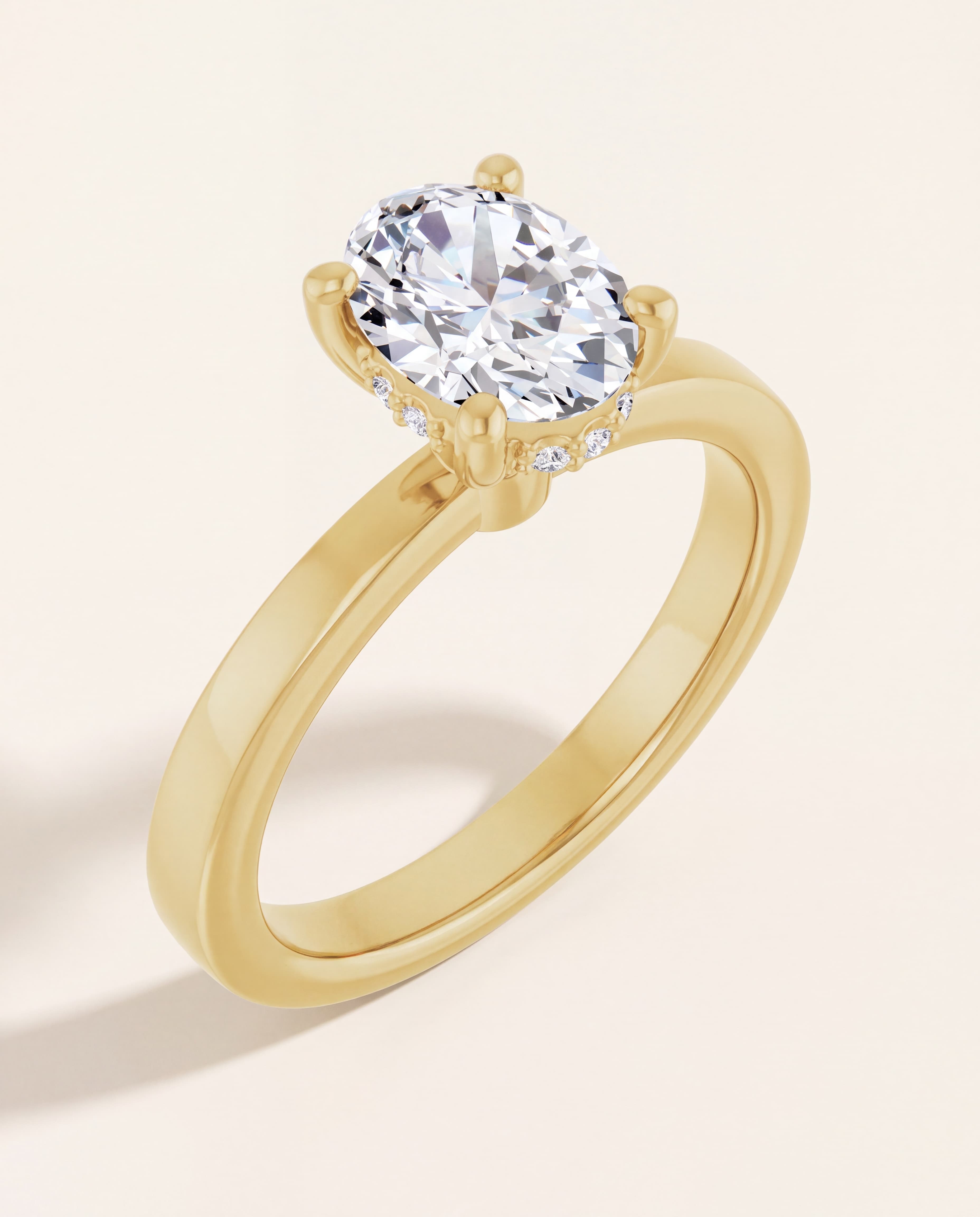 Hidden Halo Oval Engagement Ring in yellow gold