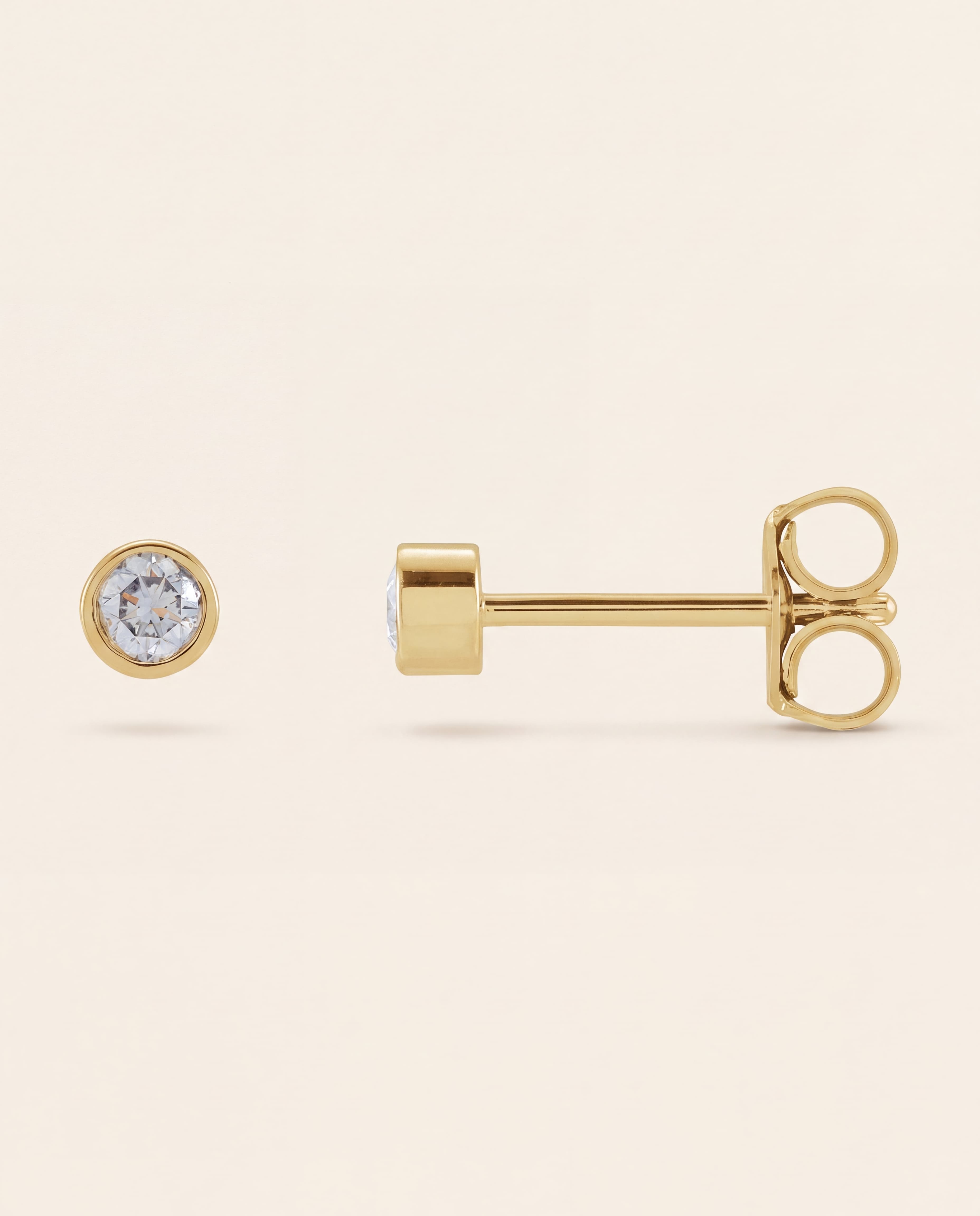 Bezel Set Round Lab-Grown Diamond Studs in yellow gold