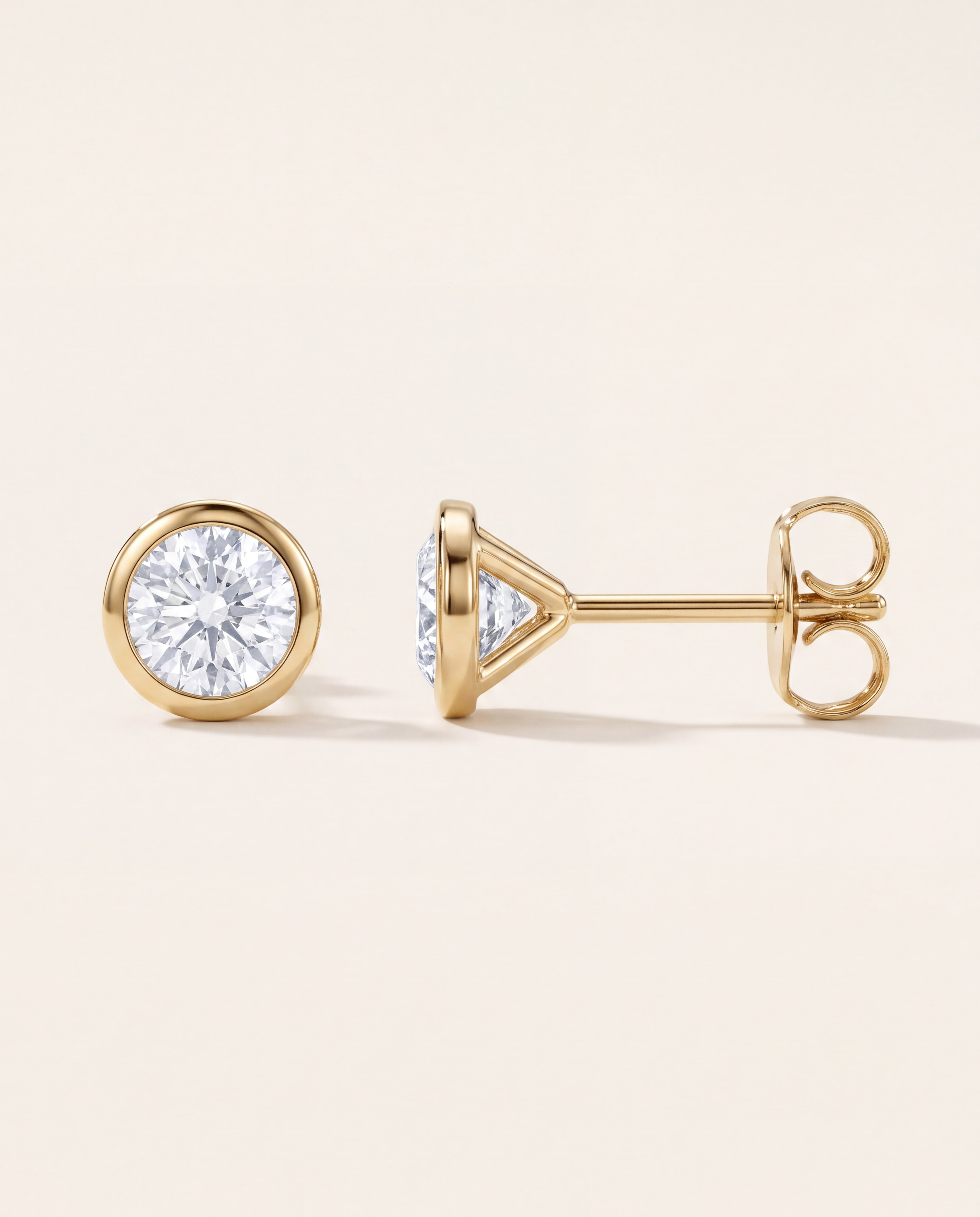 Round Bezel Set Lab-Grown Diamond Stud Earrings in yellow gold