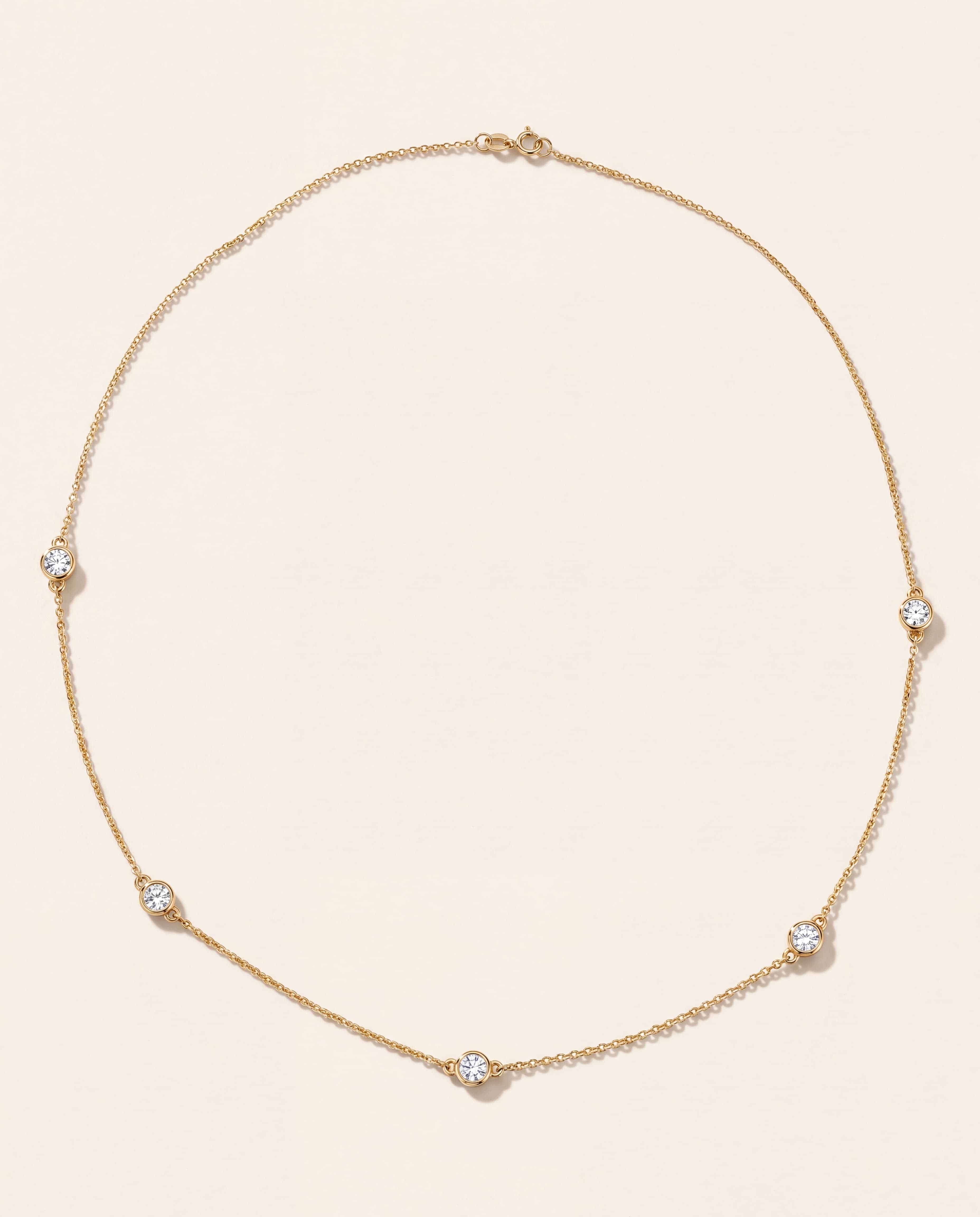 Three Station Bezel Necklace in yellow gold
