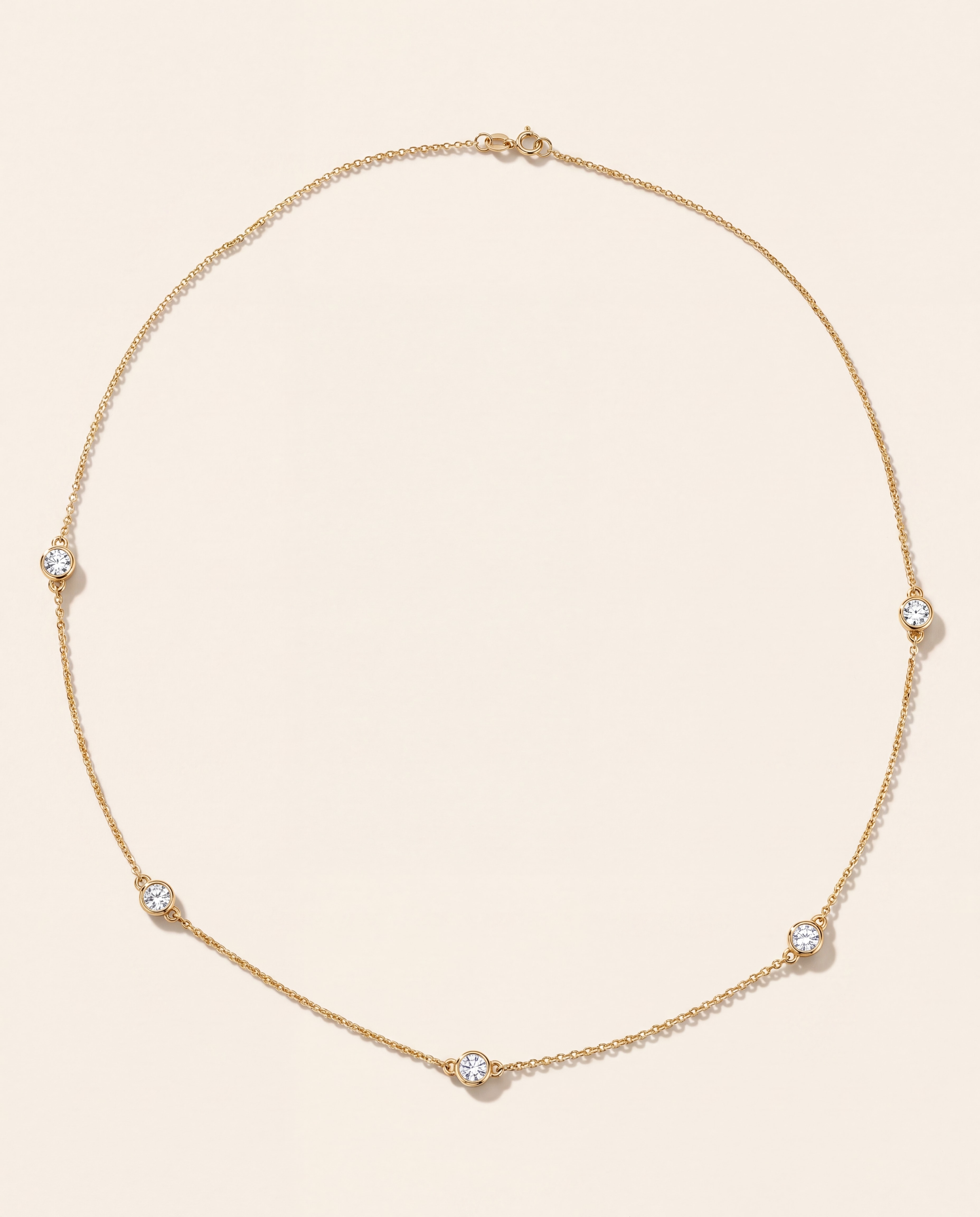 Three Station Bezel Necklace in yellow gold