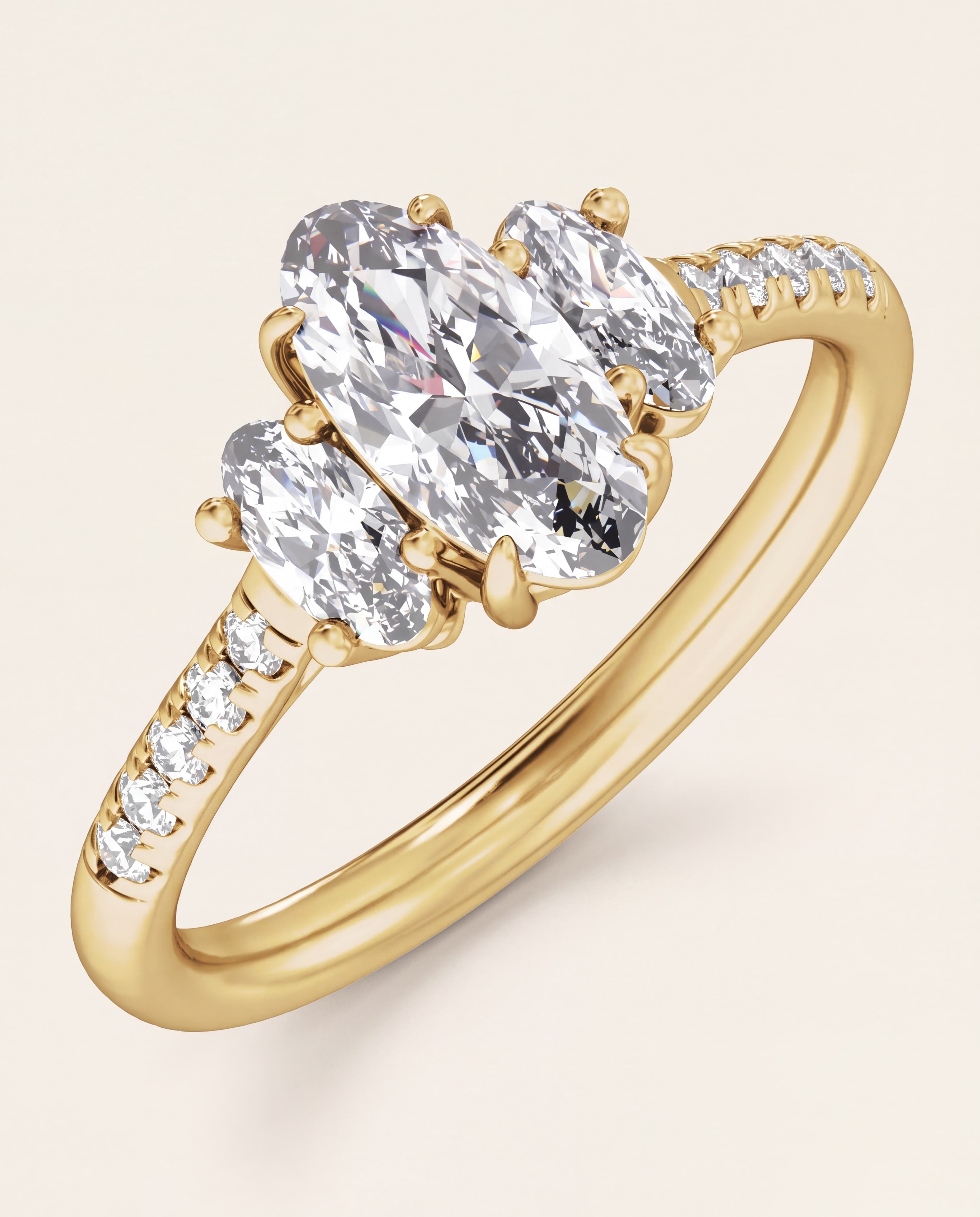Elongated Oval Three Stone Engagement Ring in yellow gold