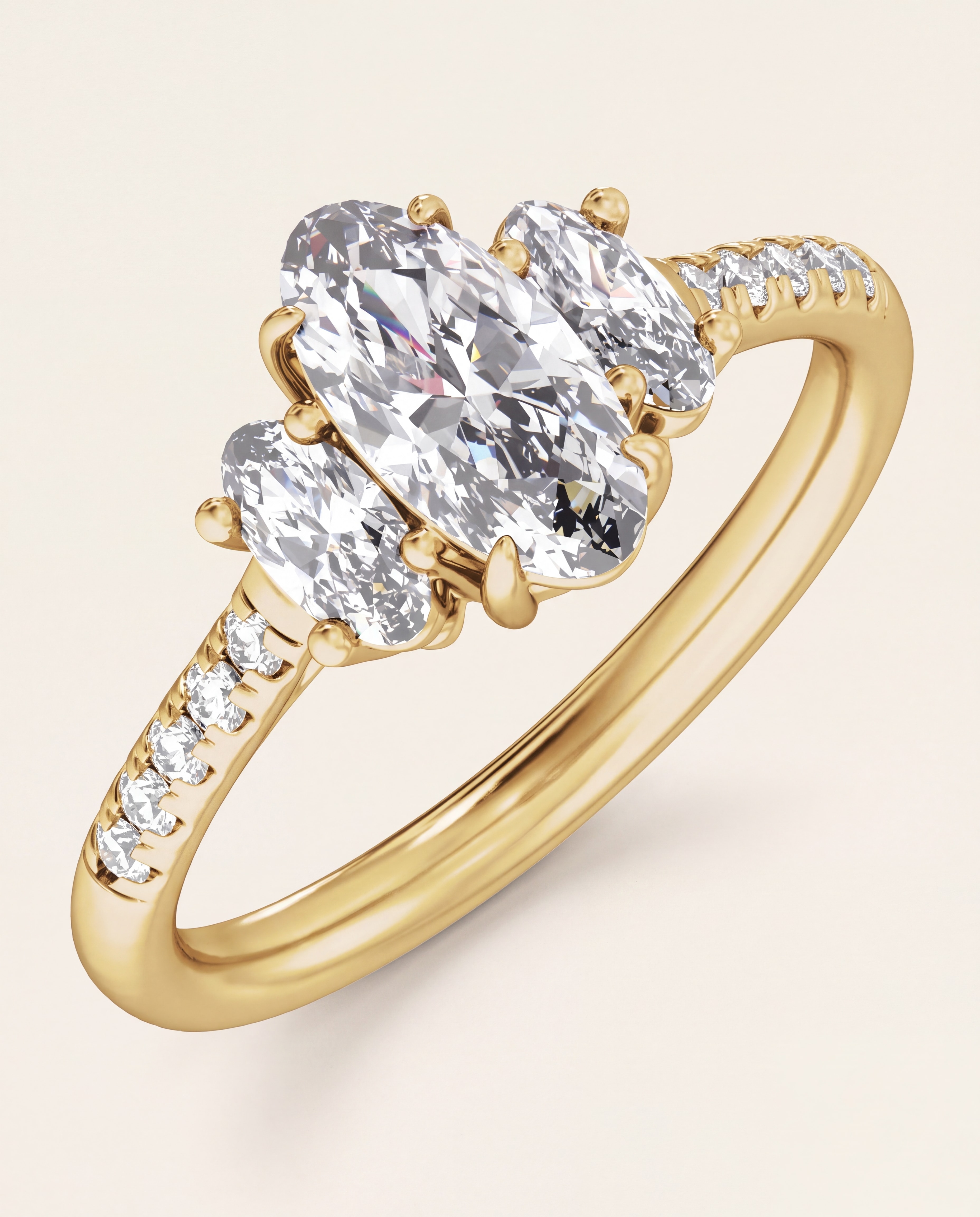 Elongated Oval Three Stone Engagement Ring in yellow gold