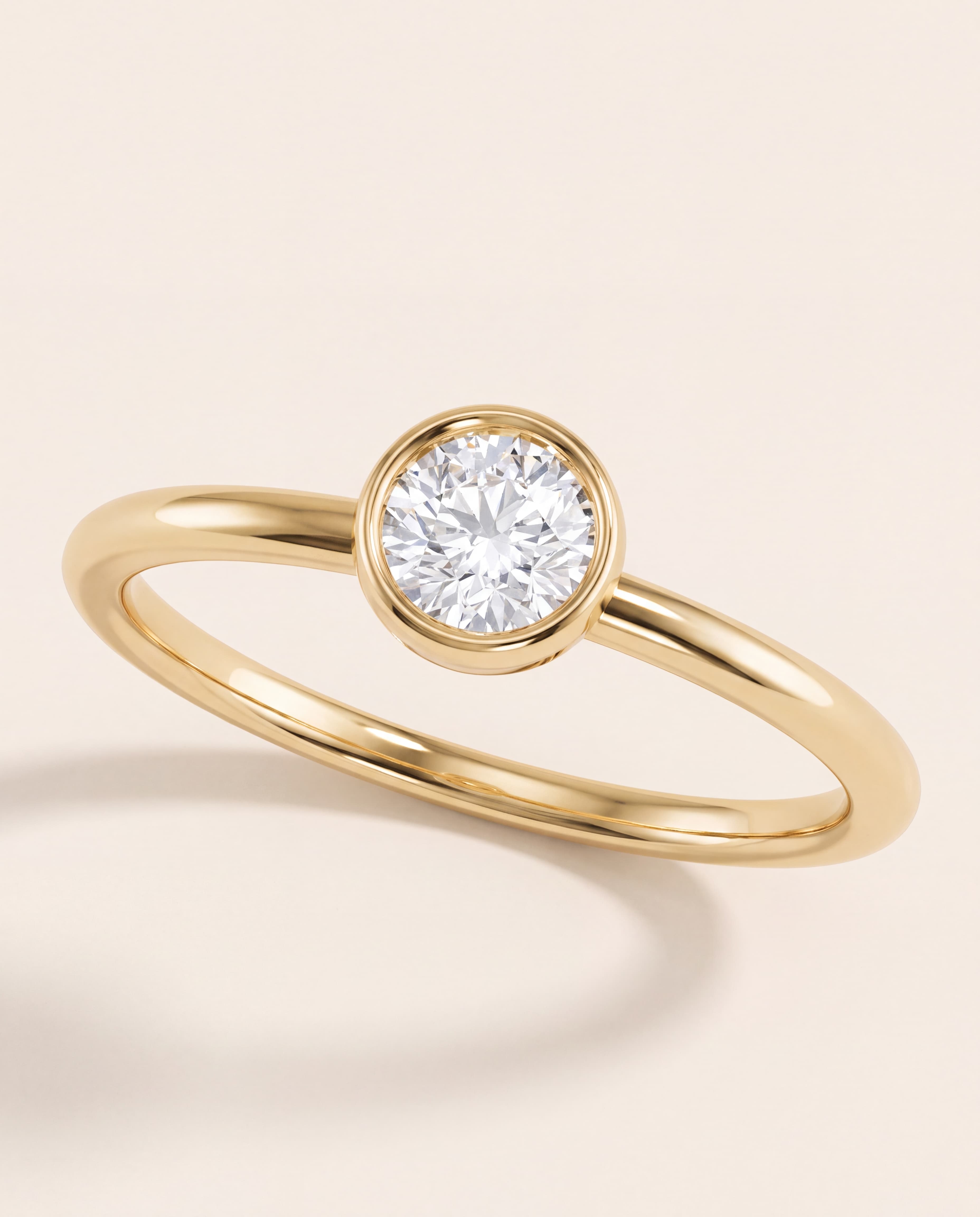 Round Bezel-Set Solitaire Ring – 0.33 CT., studio photograph