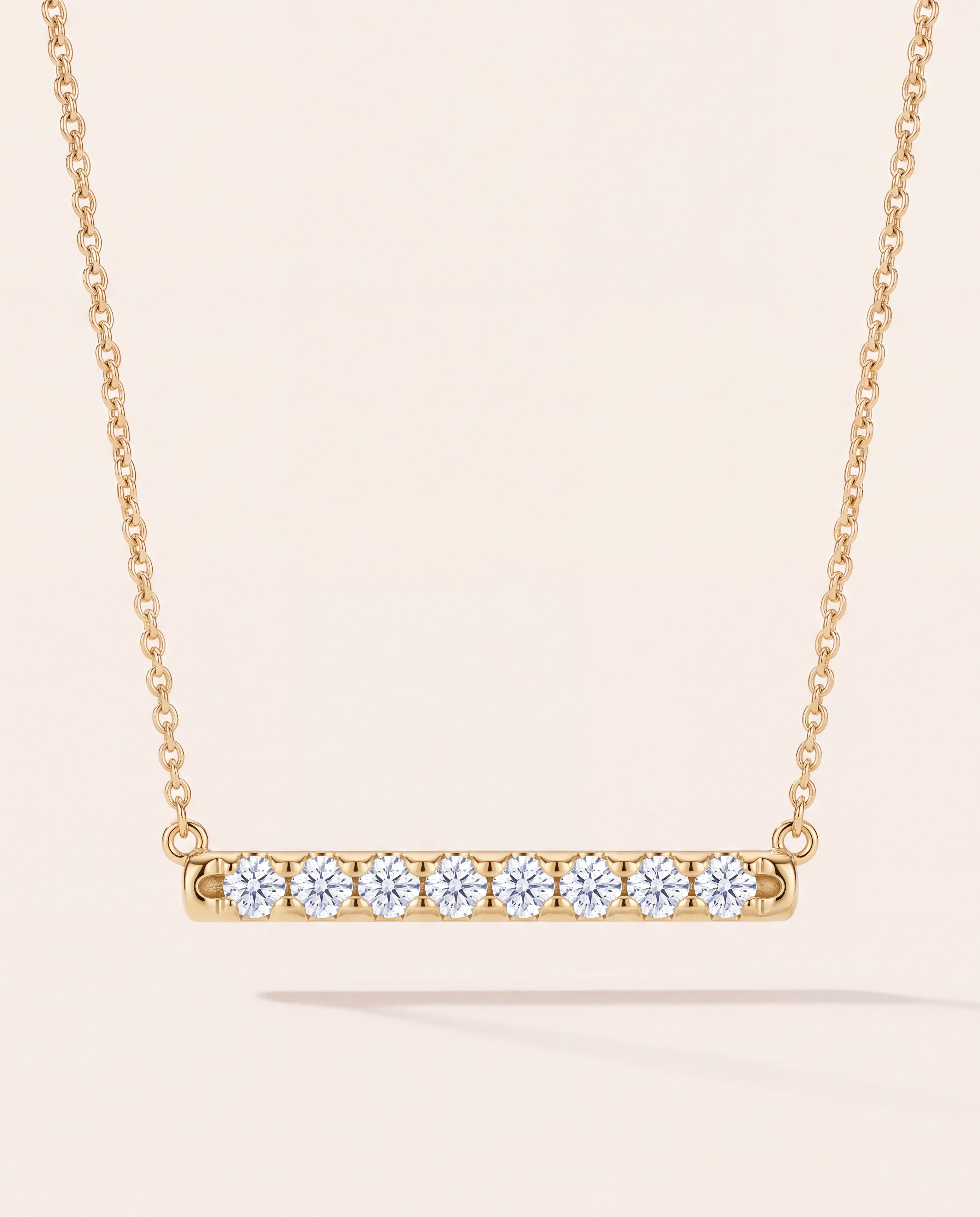 Diamond Bar Necklace in 14K yellow gold, studio photo on ivory