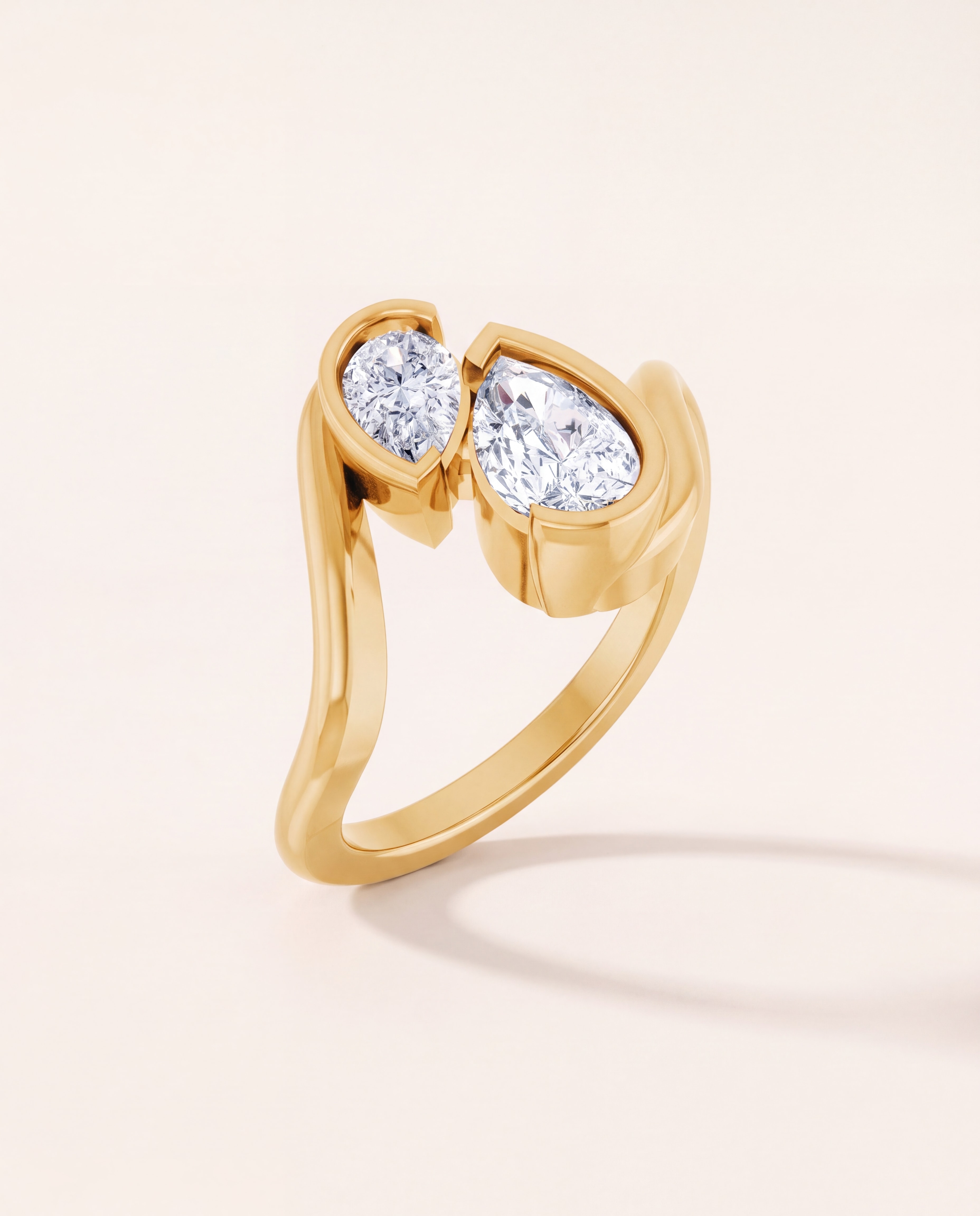 Pear Toi et Moi Engagement Ring in 14K yellow gold, studio photo on ivory