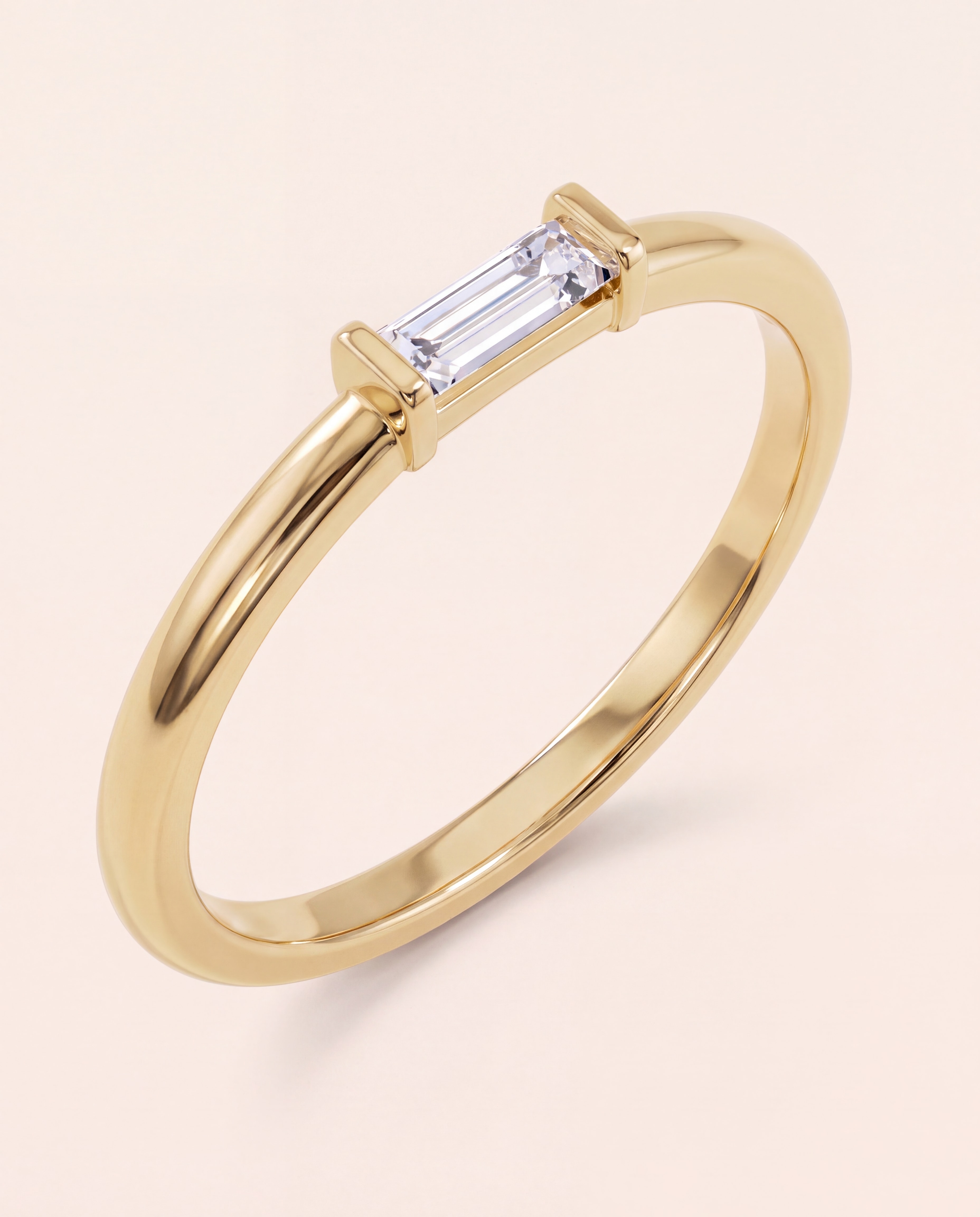 Baguette Diamond Band Ring in 14K yellow gold, studio photo on ivory